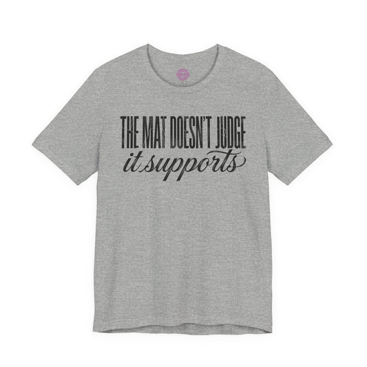 The Mat Doesn't Judge It Supports Yoga Premium Unisex T-Shirt