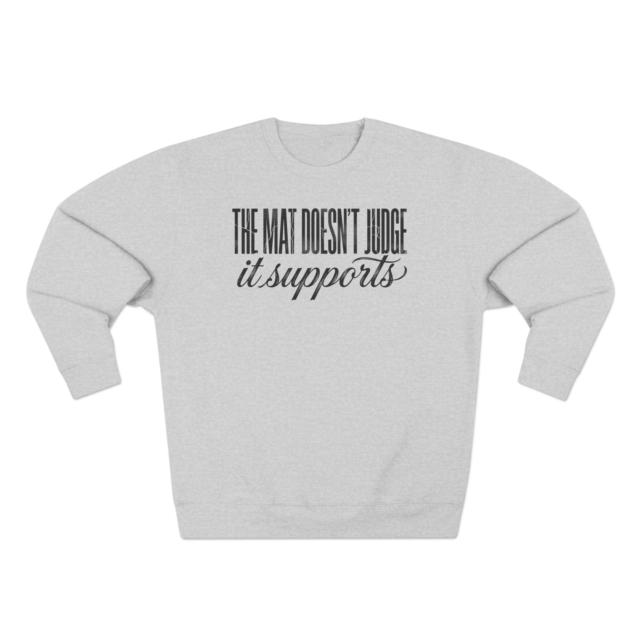 The Mat Doesn't Judge It Supports Yoga Premium Unisex Sweatshirt